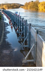 Due to climate change and global warming,emergency flood defenses put in place, to protect homes and businesses near to the river severn,torrents of water pour down from surrounding mountains.