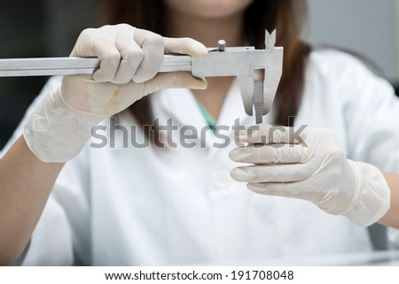 a duel scale vernier measuring calipers on a white background wi