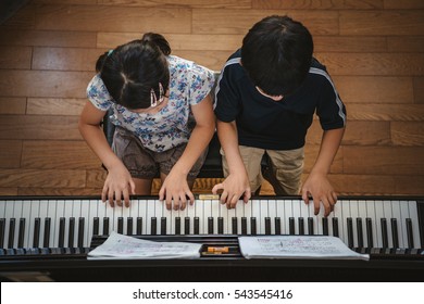 Duet Of The Piano Of Kids Pianist