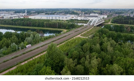 Duffel, Antwerp, Belgium, May 18th, 2022, Empty railroad running over a bridge on the river The Nete through the city of Mechelen. High quality photo