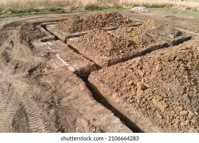 Dug out trench for building works of new house concrete foundation on construction site