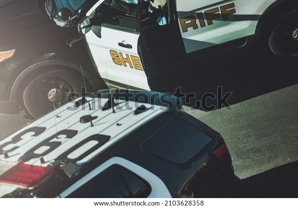 DUI or Manhunt Police Checkpoint on a Highway.\
Police Cruisers Close Up.  