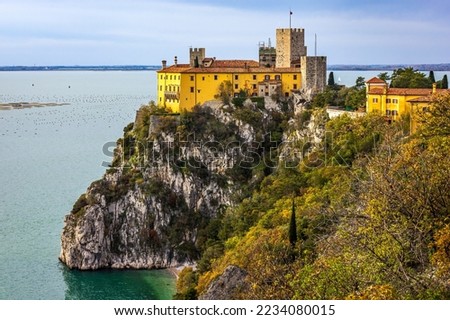 Duino Castle overlooking the Gulf of Trieste on the Adriatic Sea. Photo taken on 28th of November 2022 in Duino village, Trieste province, Italy.