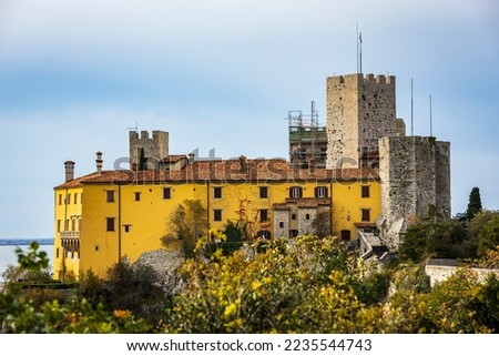 Duino Castle overlooking the Gulf of Trieste on the Adriatic Sea. Photo taken on 28th of November 2022 in Duino village, Trieste province, Italy.