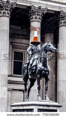 Duke of Wellington statue, with traffic cone on its head in glasgow, Scotland