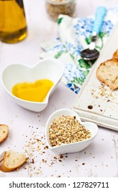 Dukkah with crusted bread and olive oil in heart shaped bowls