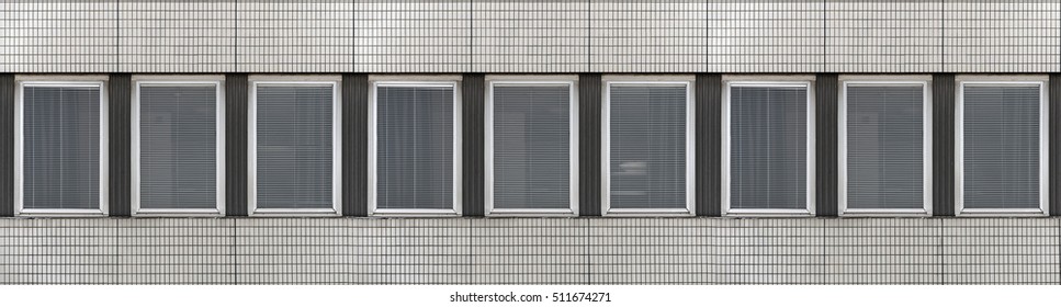 Dull facade with windows in repetitive pattern