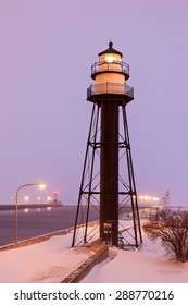 Duluth Harbor South Breakwater Inner Lighthouse During Snow Storm. Two More Lighthouses In The Background.Grand Marais, Minnesota, USA