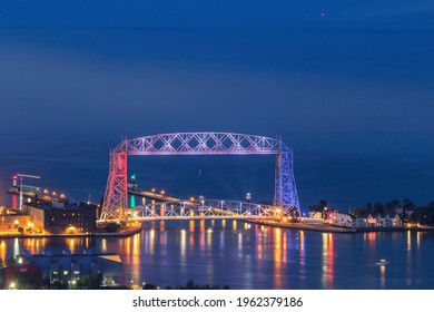DULUTH, MN - JULY 4th 2020 - A High Angle Telephoto Shot of the Duluth Aerial Lift Bridge Illuminated in Red, White, and Blue for the Fourth of July Holiday during Twilight