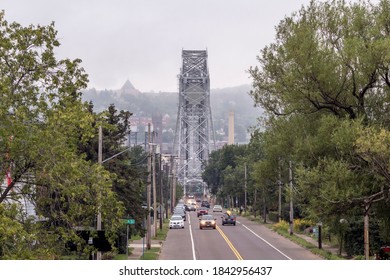 DULUTH, MN - SUMMER 2020 - A Telephoto Shot of Traffic Passing over the Duluth Aerial Lift Bridge on a Foggy Summer Day
