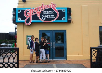 Duluth, MN USA July 30, 2008 Four Women Posing Before Entering The Well Known Grandma's Saloon And Grill In Duluth, MN.