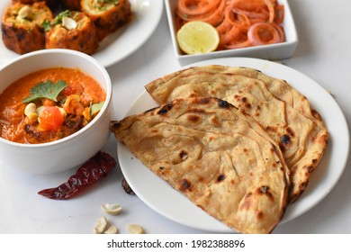 Dum Aloo Sabzi With Lachha Paratha Naan And Onions