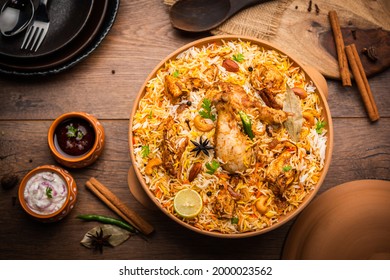 Dum Handi chicken Biryani is prepared in an earthen or clay pot called Haandi. Popular Indian non vegetarian food - Shutterstock ID 2000023562