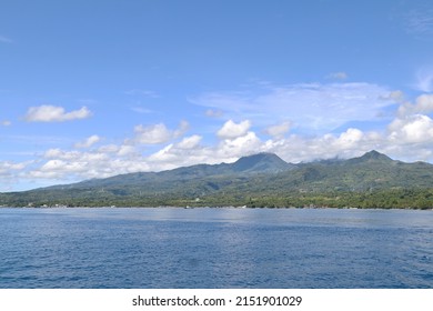 Dumaguete City, Negros Oriental, Philippines - April 29, 2022: View of the island while riding a boat.