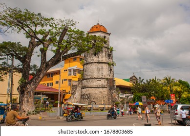 DUMAGUETE, NEGROS, PHILIPPINES – FEBRUARY 2017: Historical Bell Tower Made of Coral Stones - Dumaguete City, Negros Oriental, Philippines