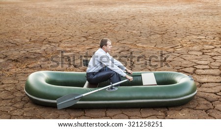 Dumb funny Business man stop on crack soil hot land desert boat businessman rock look bright future symbol crisis stagnation losses braking difficulties environmental disaster water scarcity drought
