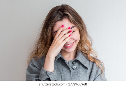 So Dumb But So Sweet. Studio Shot Of Attractive Stylish Woman Making Facepalm, Holding Hand On Eyes And Smiling, Coming To Terms With Stupid Sense Of Humour Of Boyfriend