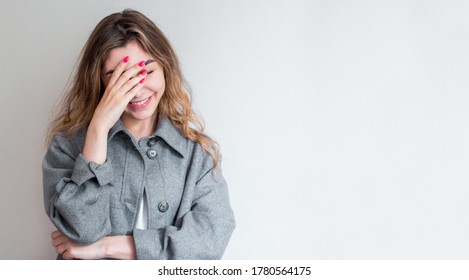 So Dumb But So Sweet. Studio Shot Of Attractive Stylish Woman Making Facepalm, Holding Hand On Eyes And Smiling, Coming To Terms With Stupid Sense Of Humour Of Boyfriend