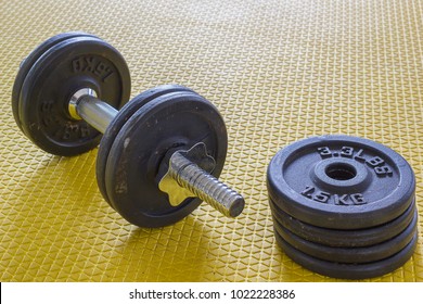 Dumbbell and fitness equipment in gym.