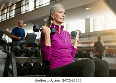 Dumbbell, fitness and music with woman on bench in gym for physical training or workout. Exercise, health and wellness with happy or mature athlete person in performance club for active challenge - Powered by Shutterstock