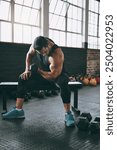 Dumbbell, fitness and weight training with man on bench in gym for bodybuilding challenge or workout. Bodybuilder, exercise and strength with muscular athlete in health club for physical improvement