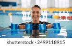 Dumbbell, portrait and mature woman in swimming pool for exercise, healthy body and strong muscle. Therapist, water and aerobics class for fitness, physiotherapy or rehabilitation of senior person