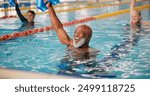 Dumbbell, training and mature man in swimming pool for exercise, healthy body and strong muscle. Weight, water and aerobics class for fitness, physiotherapy and rehabilitation of happy senior people