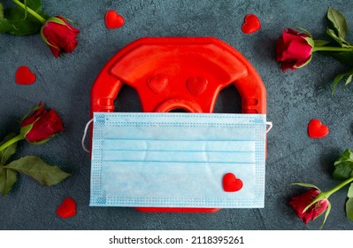 Dumbbell Weight Plate In Face Mask COVID-19 Coronavirus, Red Roses. Love Gift For Valentine's Day, Birthday, Anniversary, Wedding. Lockdown Home Gym Workout, Fitness Exercise Flat Lay Composition.