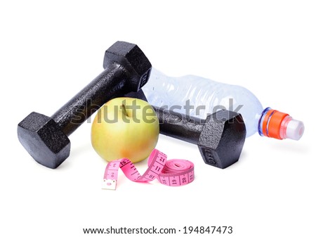 Dumbbells, apples, centimeter and bottle isolated on white background