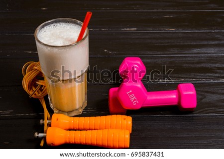 Dumbbells, skipping rope and protein