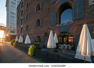 Dumbo Building With West Elm Store And Other Coffee Shops Next To Hudson River Between Manhattan And Brooklyn Bridges. New York, 2021.