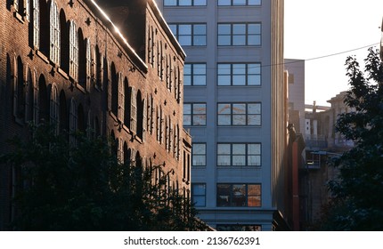 Dumbo Building With West Elm Store And Other Coffee Shops Next To Hudson River Between Manhattan And Brooklyn Bridges. New York, 2021.