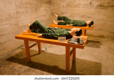 Dummies simulating two wounded North Vietnamese soldiers in the infirmary during the Vietnam War. Hospital Cave. Cat Ba Island. Vietnam.