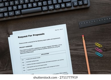 A dummy document of the Request For Proposal is on the desk, along with a calculator and a pen.