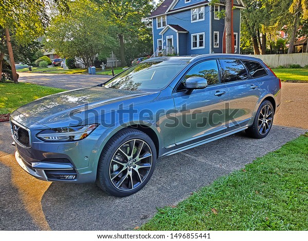 DUMONT, NEW JERSEY - AUGUST 9, 2019: A 2019\
Volvo 90 Cross Country T6.The 2019 Volvo V90 is a luxury station\
wagon with a raised ride height and standard All-Wheel Drive\
provide extra\
confidence.