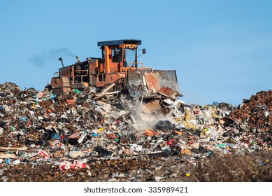 The dump and the bulldozer - Powered by Shutterstock