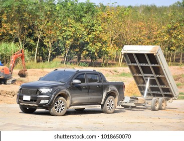 Dump Car Trailer Load Of Rock And Soil On A Site Construction House And Garden Project. Work At Home. 