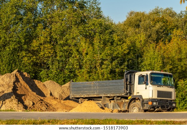 Dump loader ready for loading. Dump truck for loading \
gravel and sand 