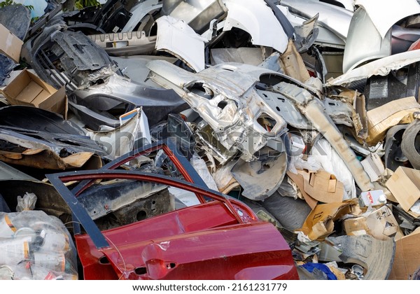 dump of spare parts of broken cars, scrap metal\
from cars.