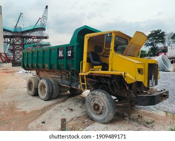 Dump trucks are used to transport  loose materials such as dirt, sand, ores, gravel, and demolition waste across mining, civil or major construction sites. DT 12 on a lorry means Dumper Lorry No. 12.