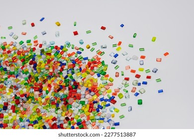 dumped transparent plastic resin granulates on white table in lab - Shutterstock ID 2277513887