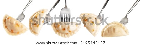 Dumpling with fried onions impaled on a fork  isolated on white background. Collection with clipping path.