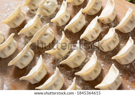 Dumplings background. Cooking dumplings in the kitchen.