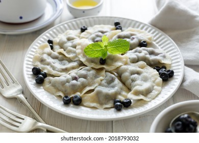 Dumplings With Blueberries On A White Plate, Close Up View. Traditional Dish In Poland