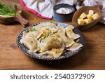 Dumplings filled with ground meat. Varenyky, vareniki, pierogi, pyrohy - dumplings with filling