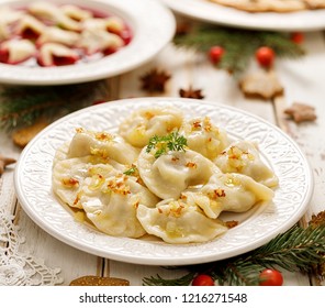 Dumplings With Mushroom Cabbage Filling On A White Plate. Vegetarian Food, Traditional Christmas Eve Dish In Poland