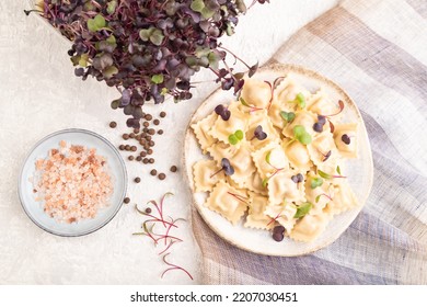 Dumplings With Pepper, Salt, Herbs, Microgreen On Gray Concrete Background And Linen Textile. Top View, Flat Lay, Close Up.