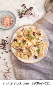 Dumplings With Pepper, Salt, Herbs, Microgreen On Gray Concrete Background And Linen Textile. Top View, Flat Lay, Close Up.