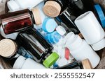 A dumpster overflowing with plastic medicine containers plastic pollution in the pharmaceutical industry waste.