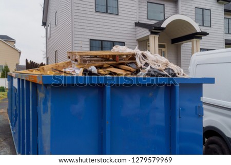 Dumpsters being full with garbage